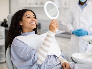 Woman admiring teeth whitening results